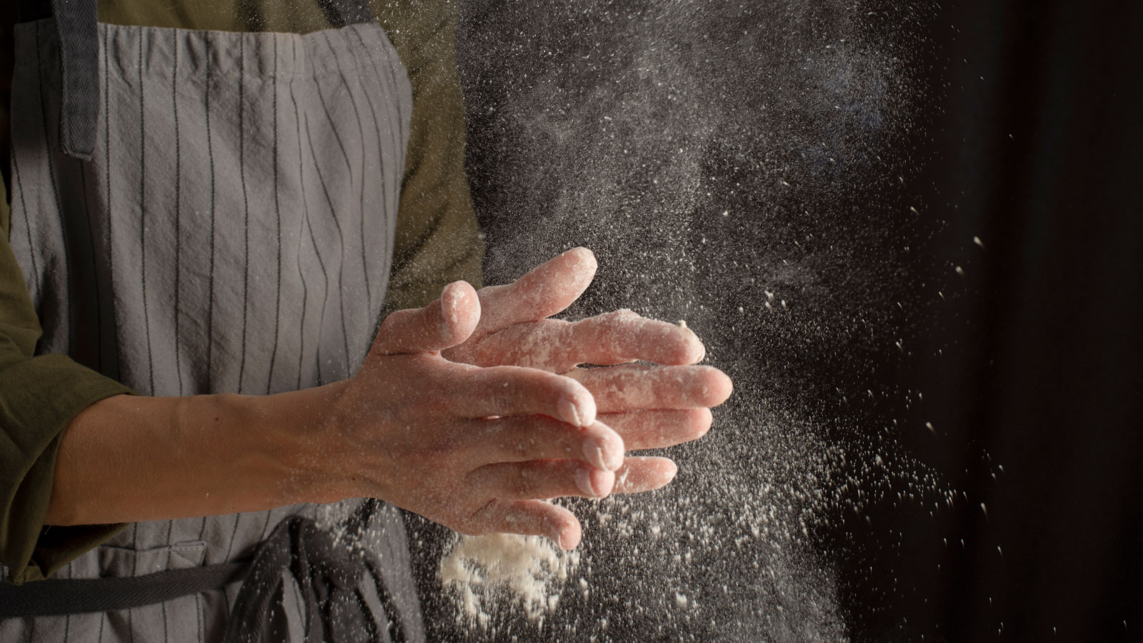 close up hands with flour
